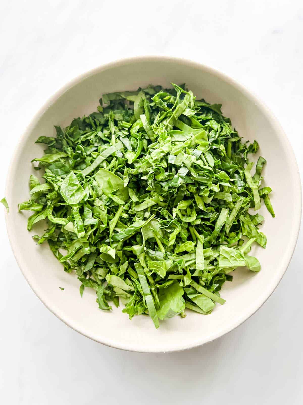Chopped spinach in a bowl.