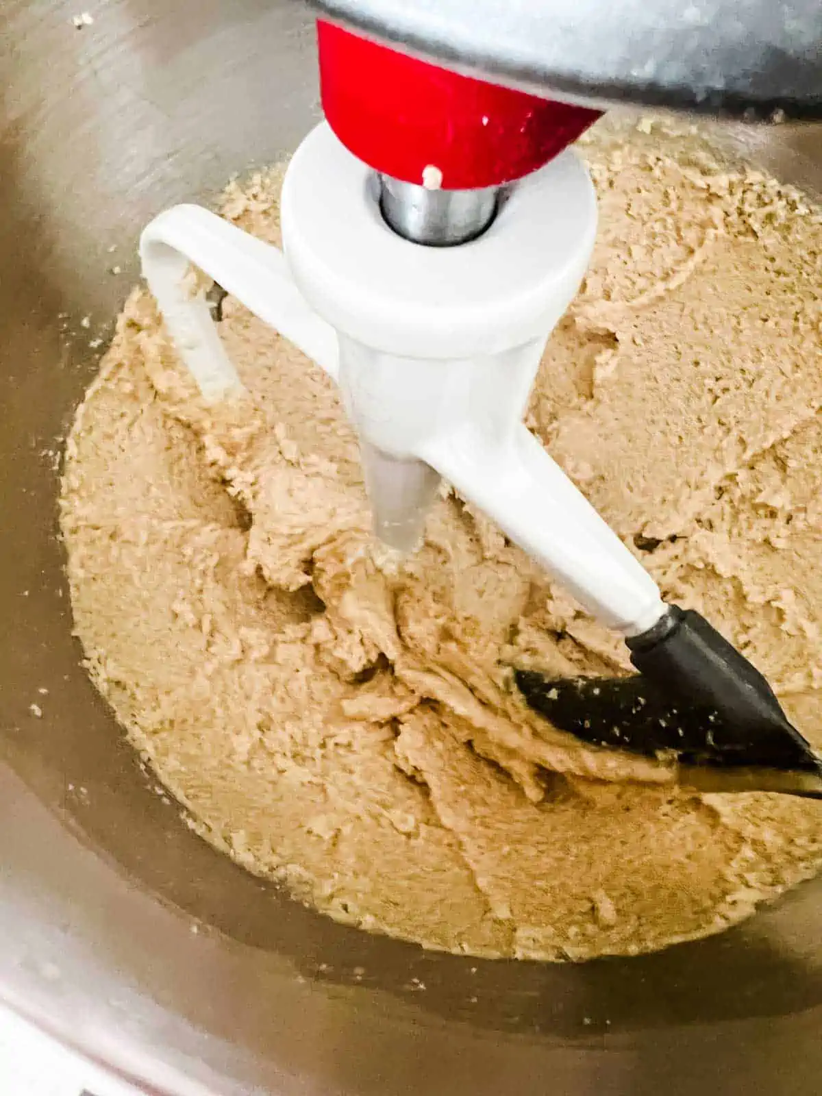 Sugars and butter whipped together in the bowl of a stand mixer.