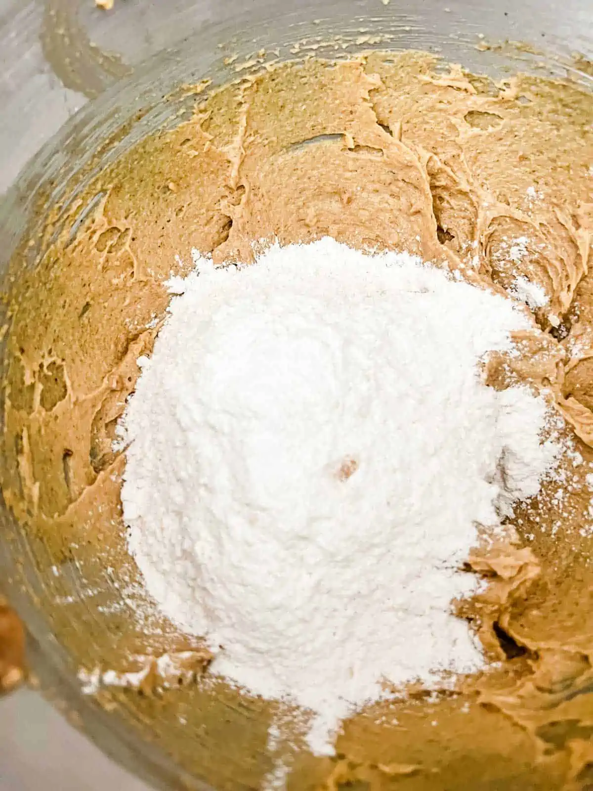 Photo of whipped peanut butter, sugar, and butter with flour added to it.