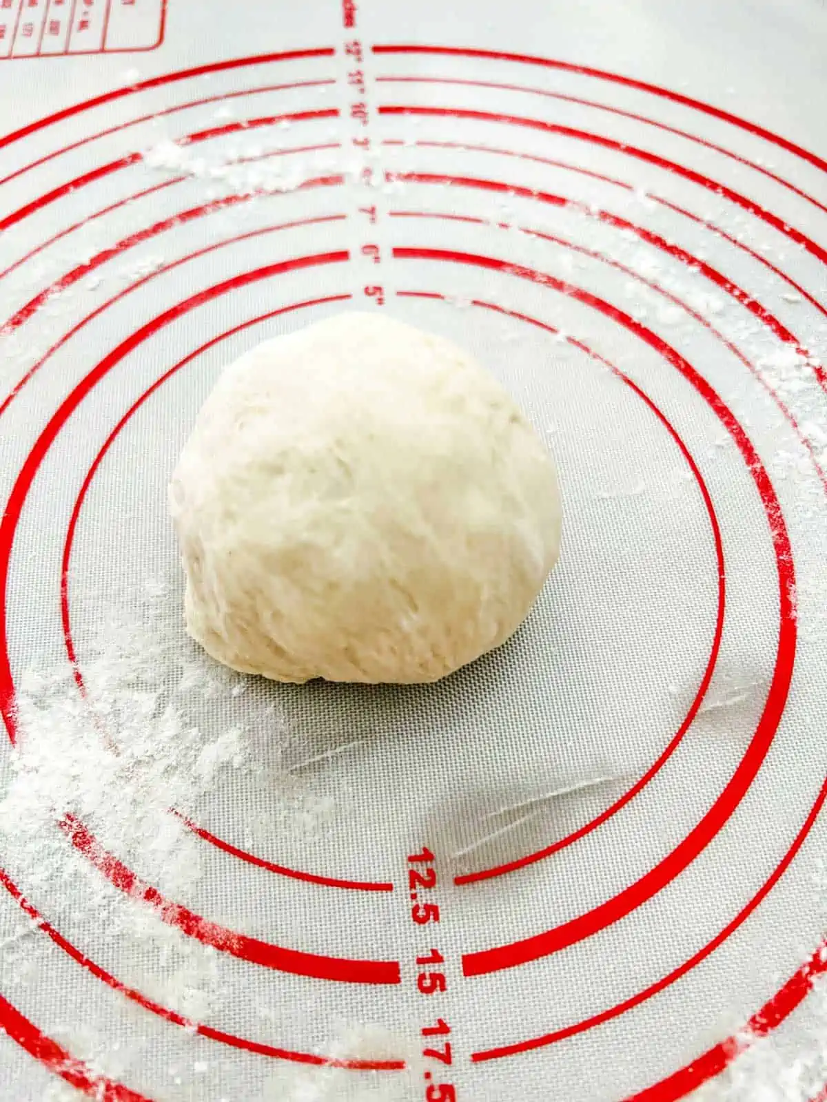 Photo of a ball of burger bun dough.