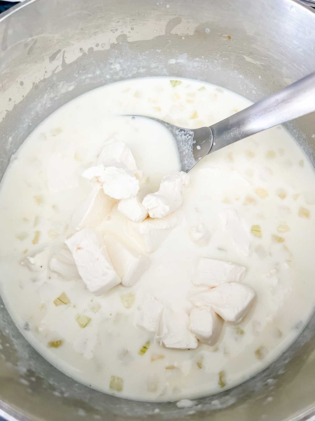 Photo of cream cheese that has been added to a sauce.