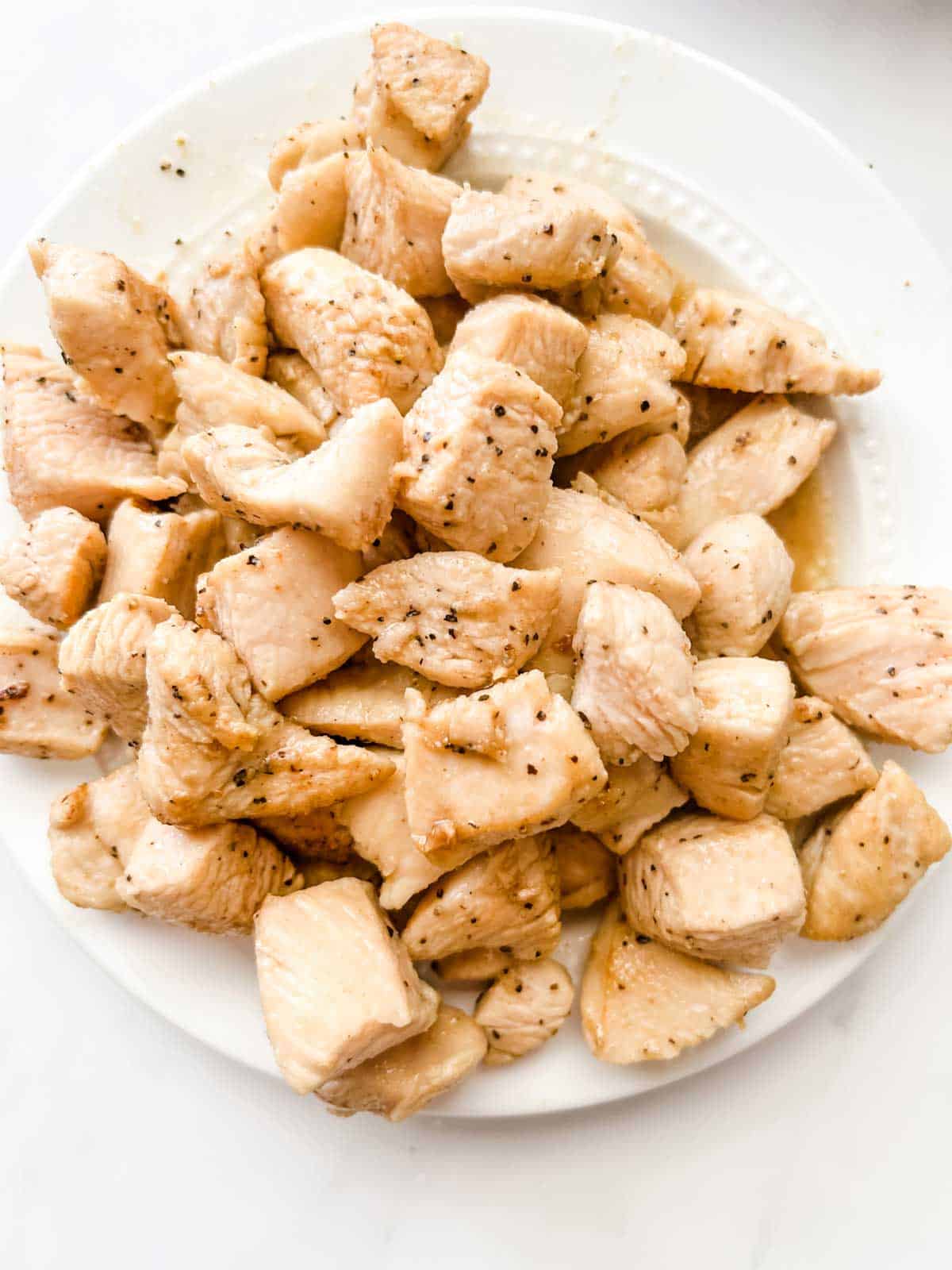 Photo of cubed cooked chicken.