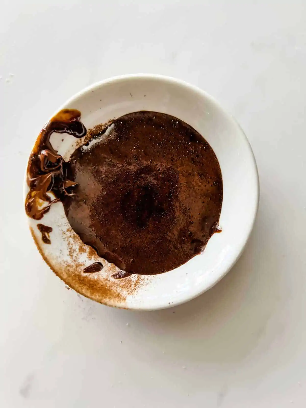 Powdered espresso and water in a small dish.