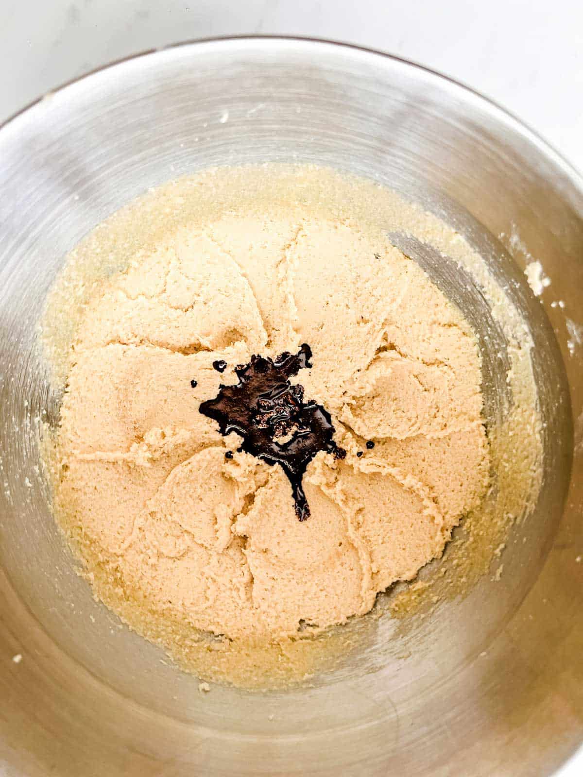 Espresso and water mixture that has just been added to creamed butter and sugar.