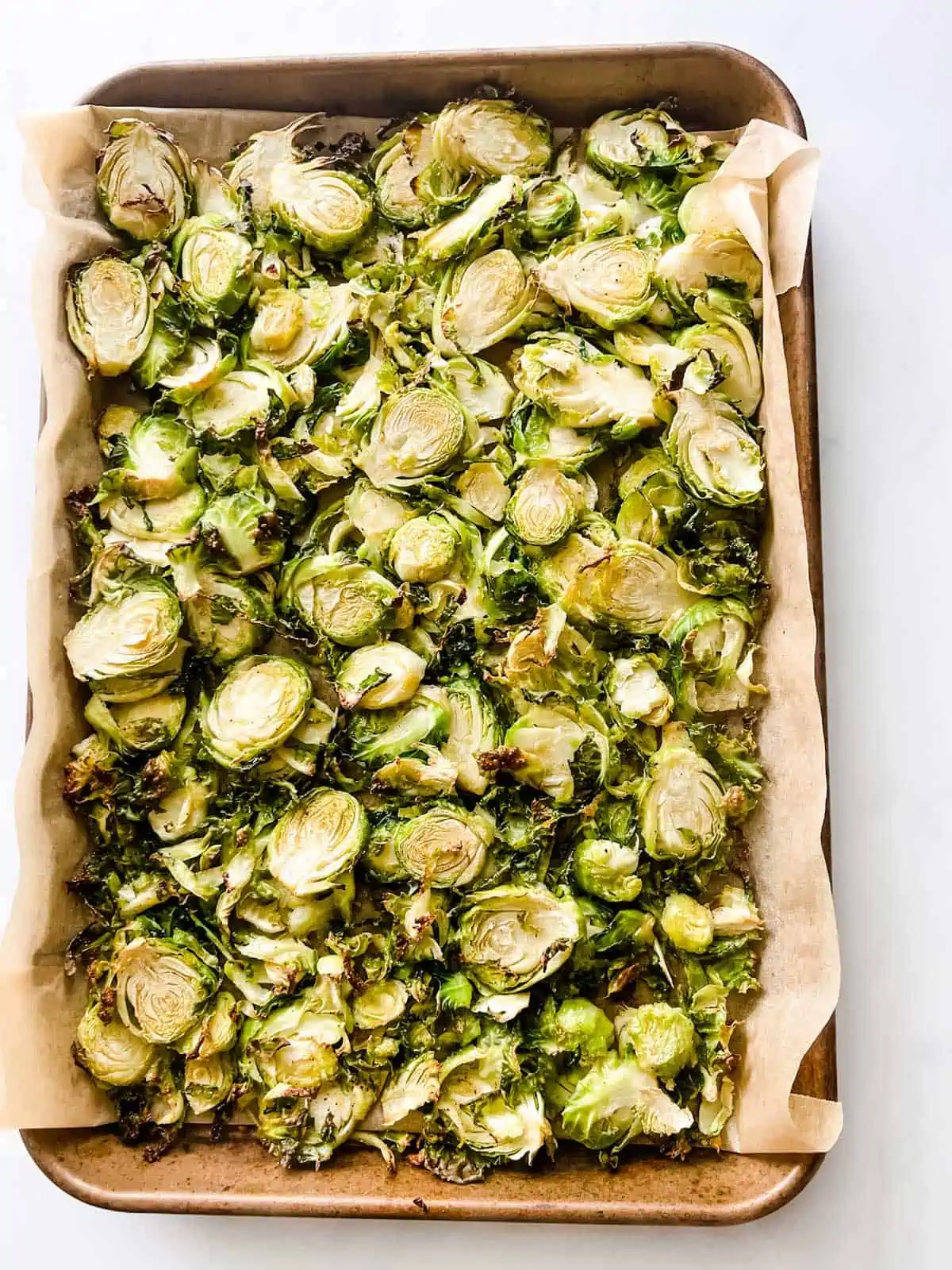 Photo of roasted Brussels sprouts that have just been removed from the oven.