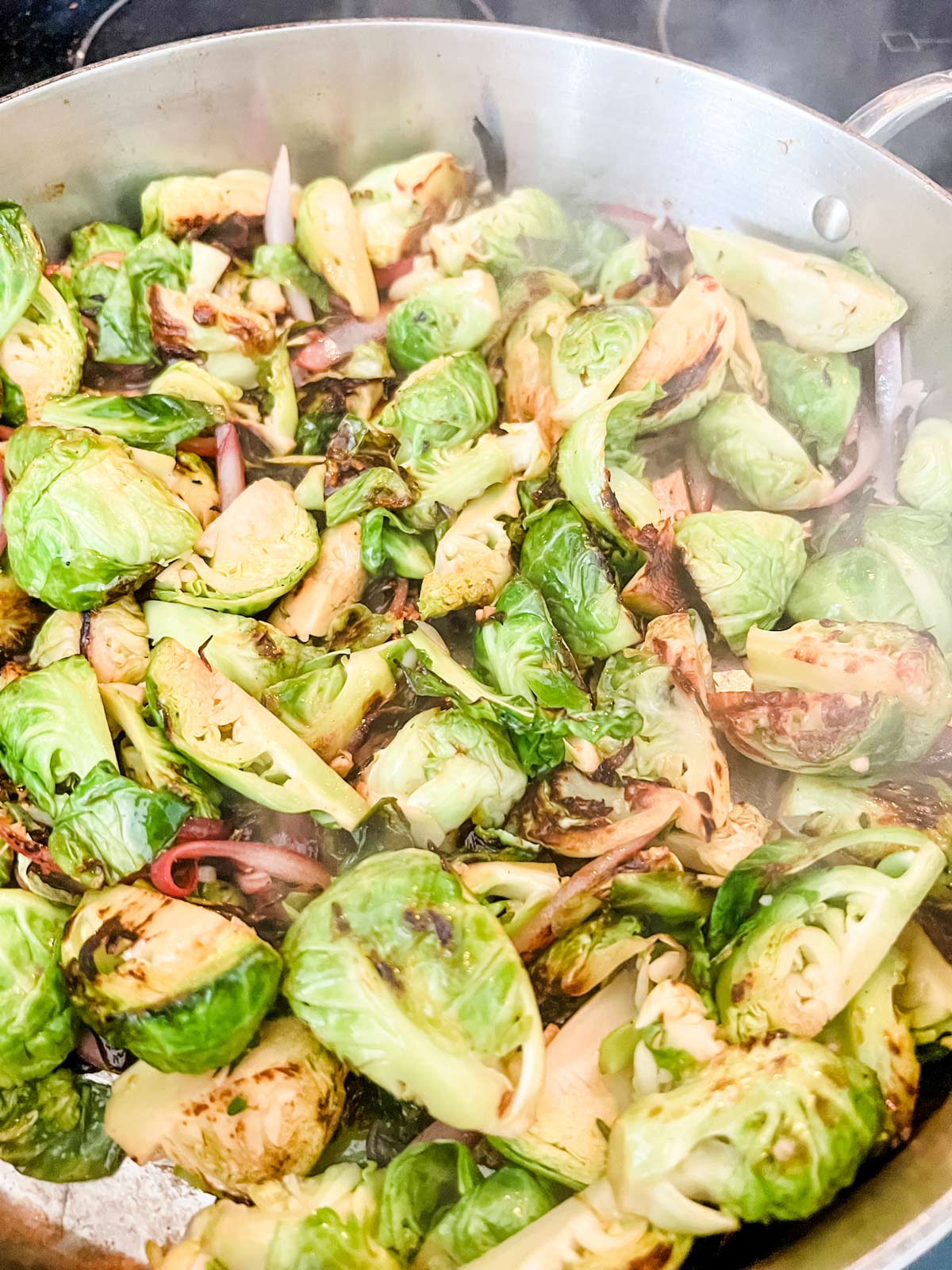 brussels sprouts onion, and garlic in a large skillet with a lemon balsamic sauce.