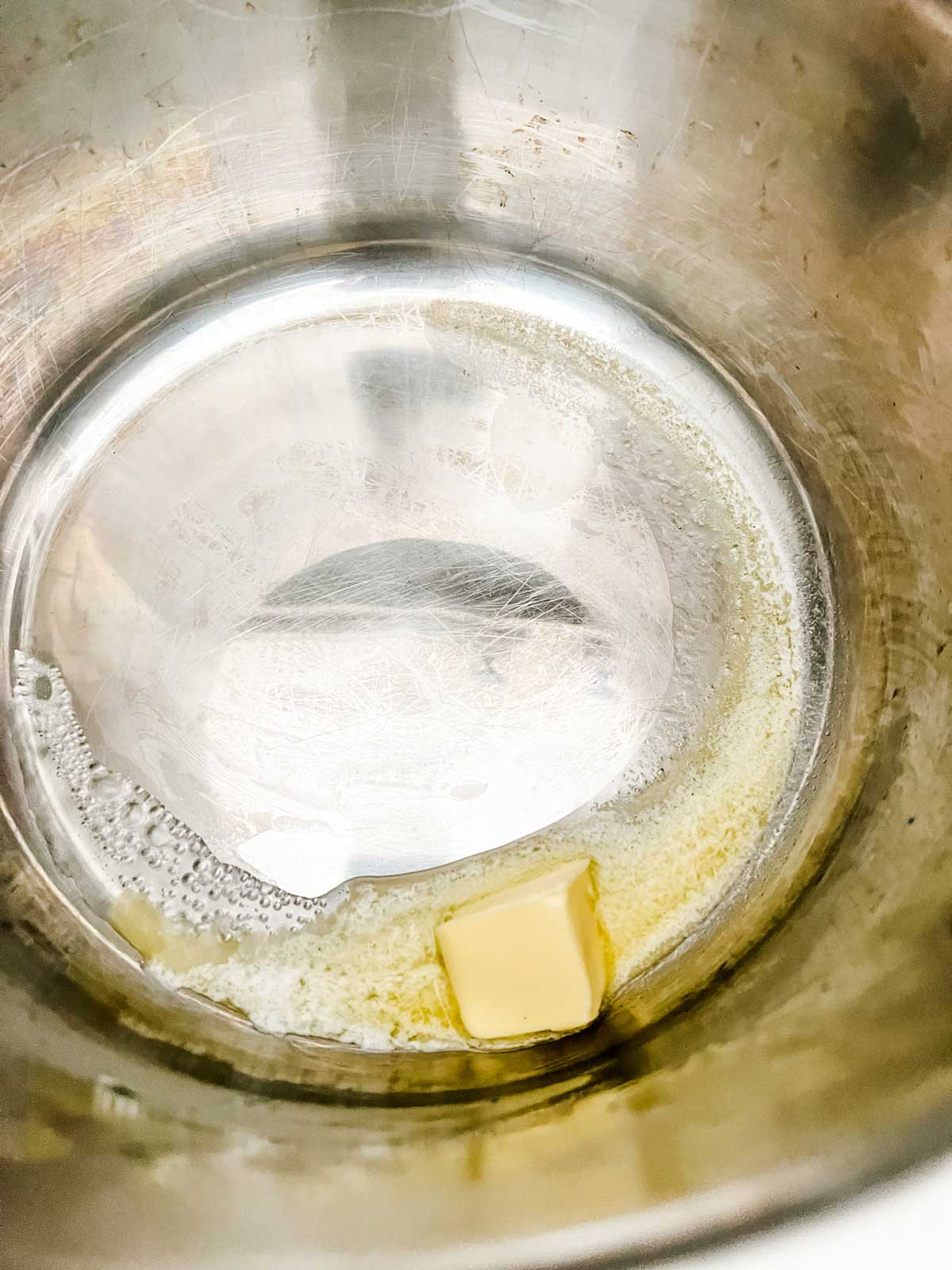 Photo of butter melting in an Instant Pot.