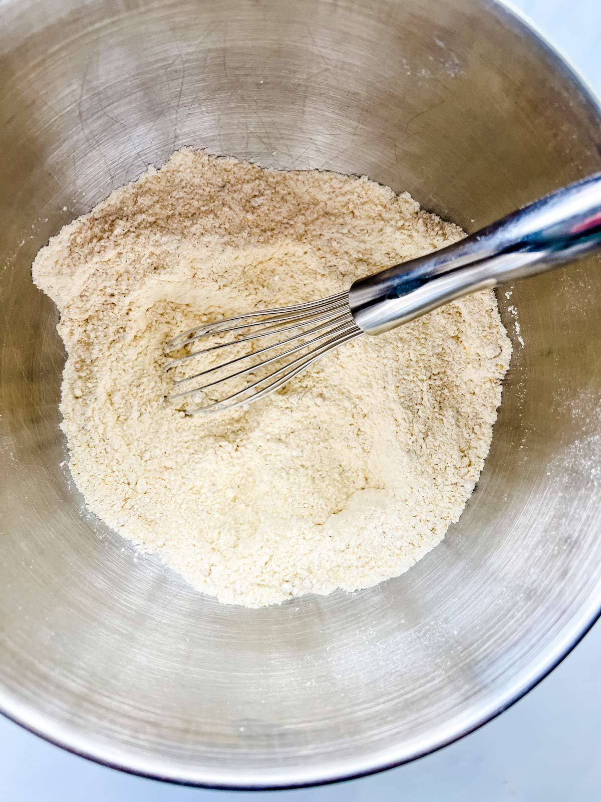 Cornmeal, flour, sugar, baking powder, baking soda, salt, and sage in a large bowl