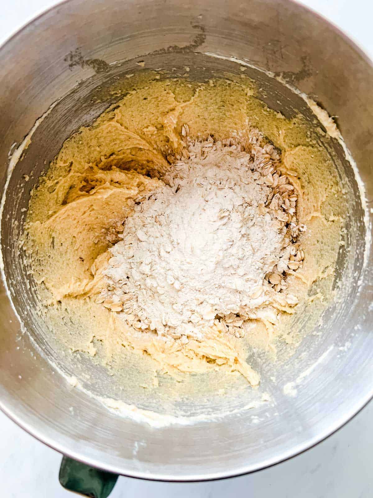 Photo of the creamed butter mixture for cookies that have just had the flour mixture added to them.