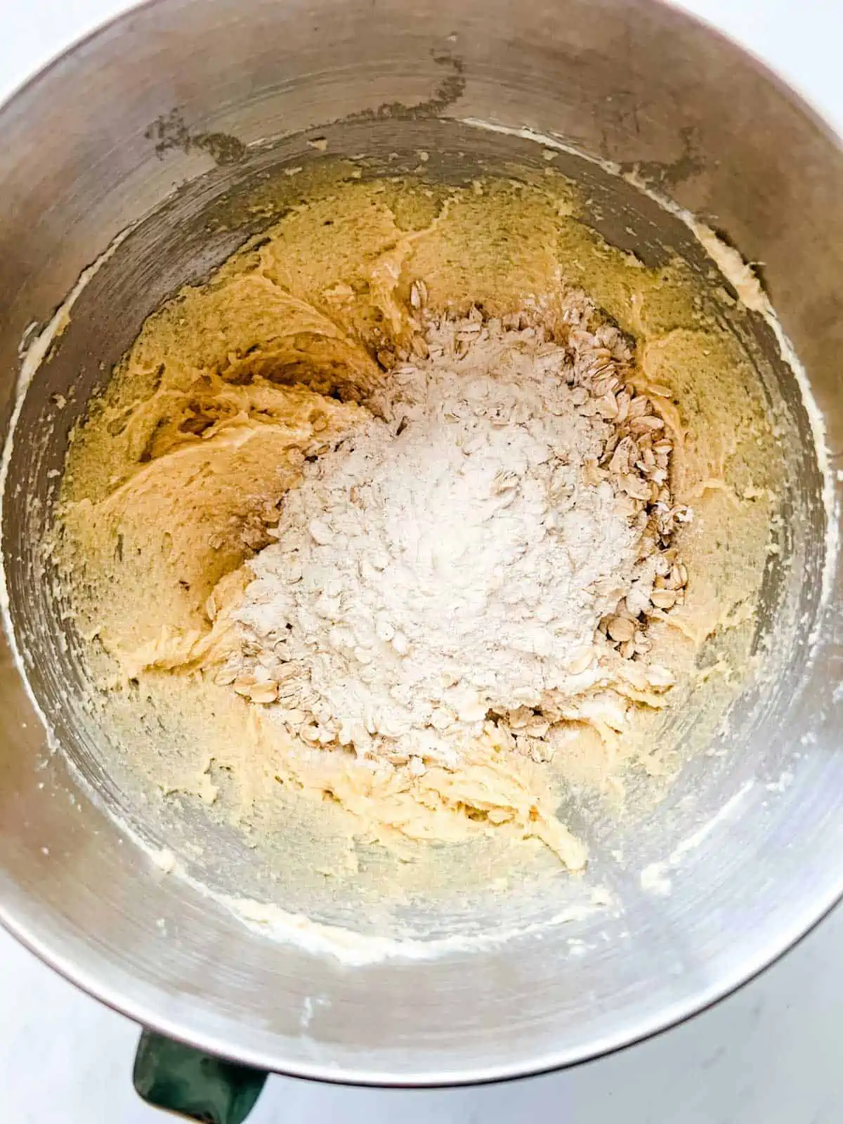 Photo of the creamed butter mixture for cookies that have just had the flour mixture added to them.