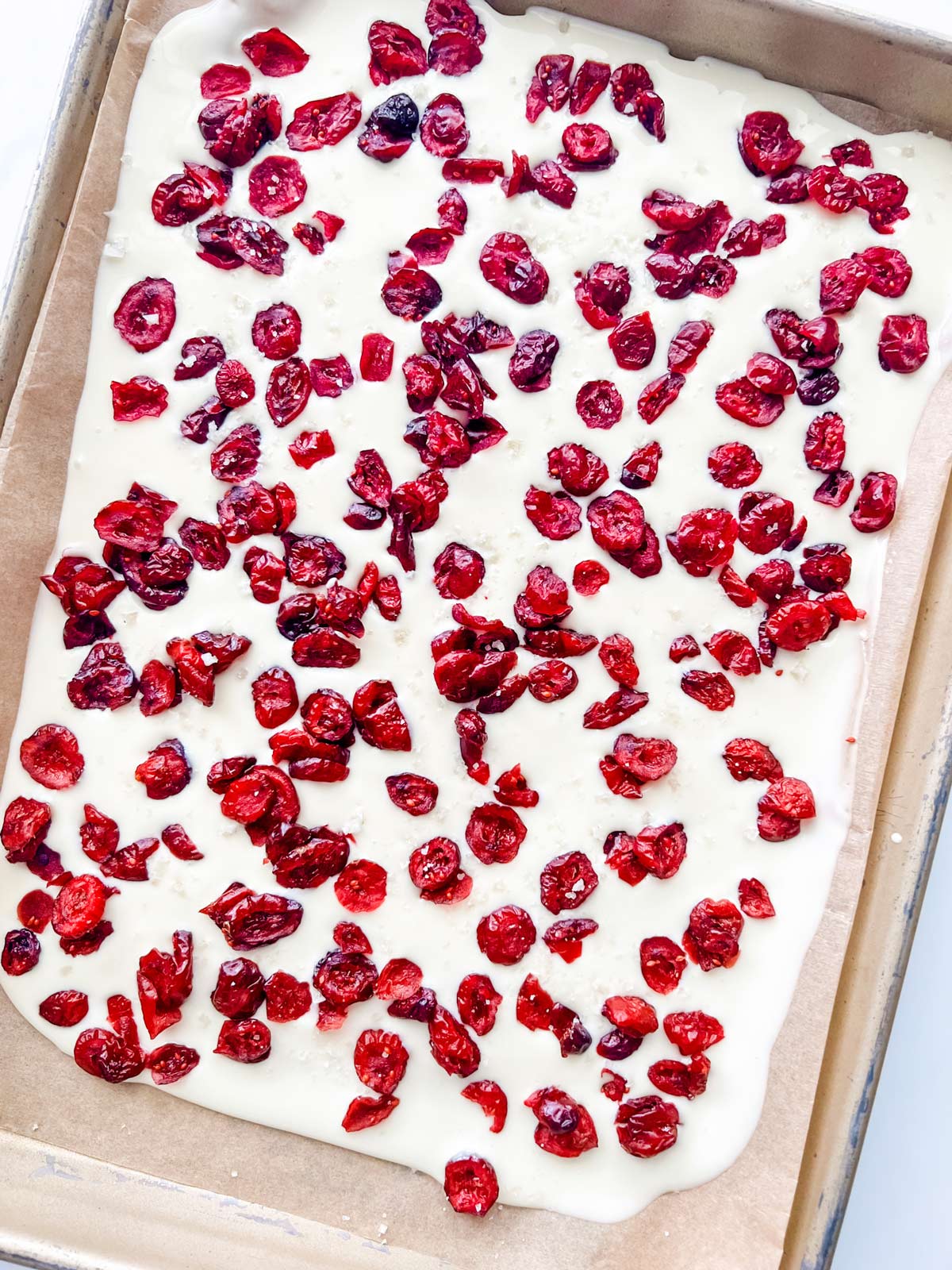 Photo of white chocolate bark that has hardened and is ready to break apart.