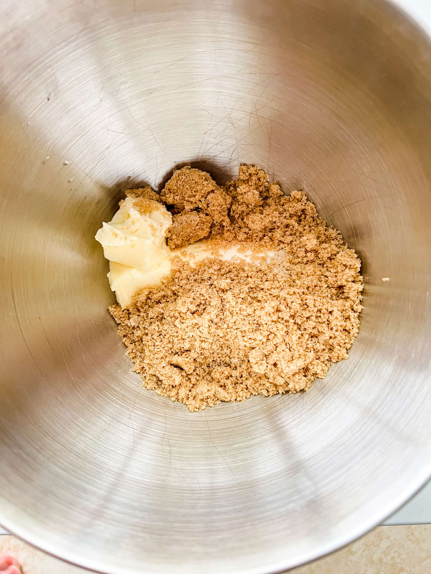Photo of brown sugar, white sugar, and butter in a mixing bow.