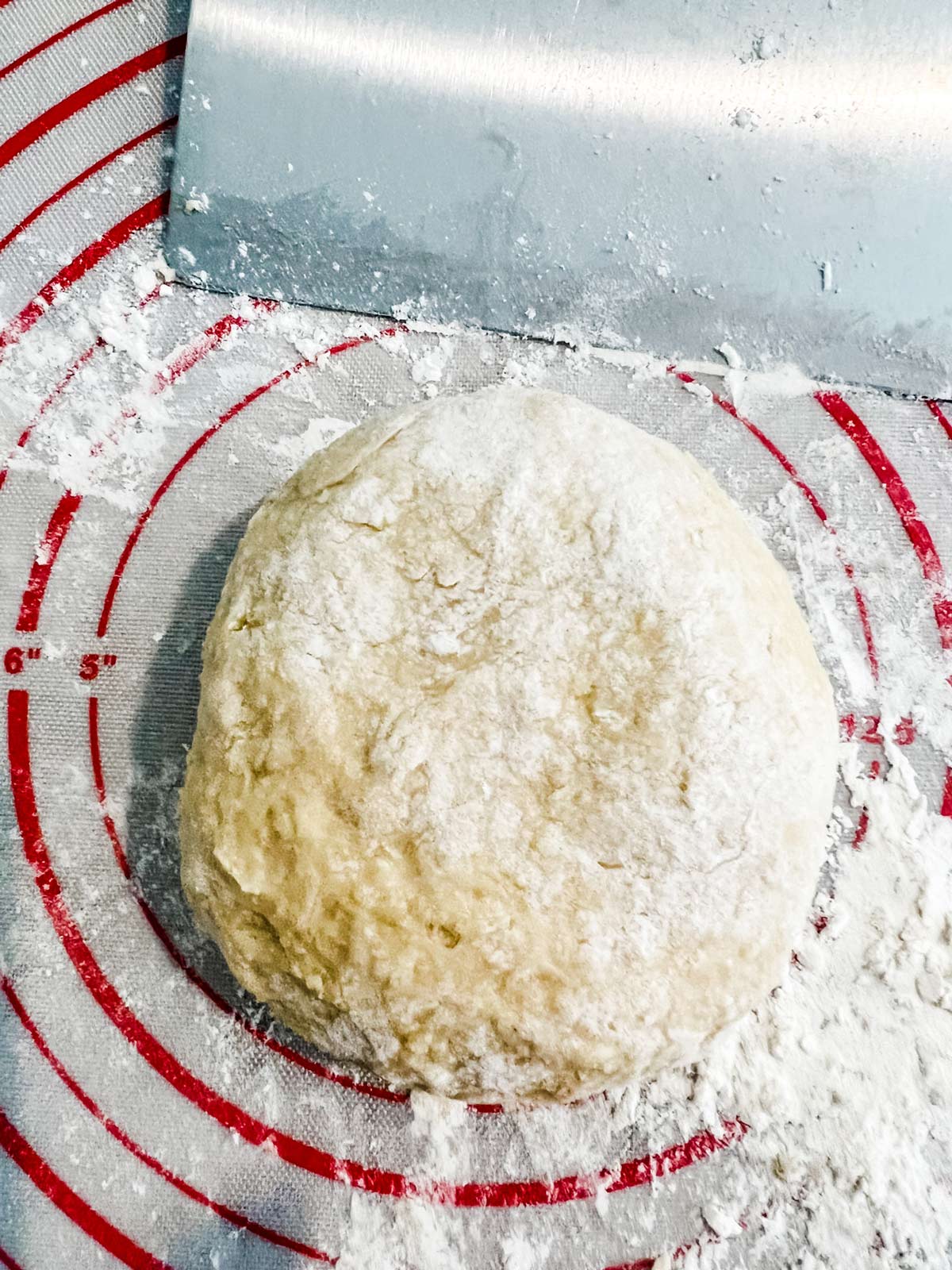 A ball of brioche ready for the bread pan.
