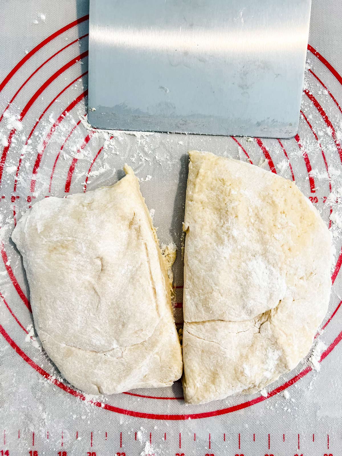 Brioche dough cut into two pieces.