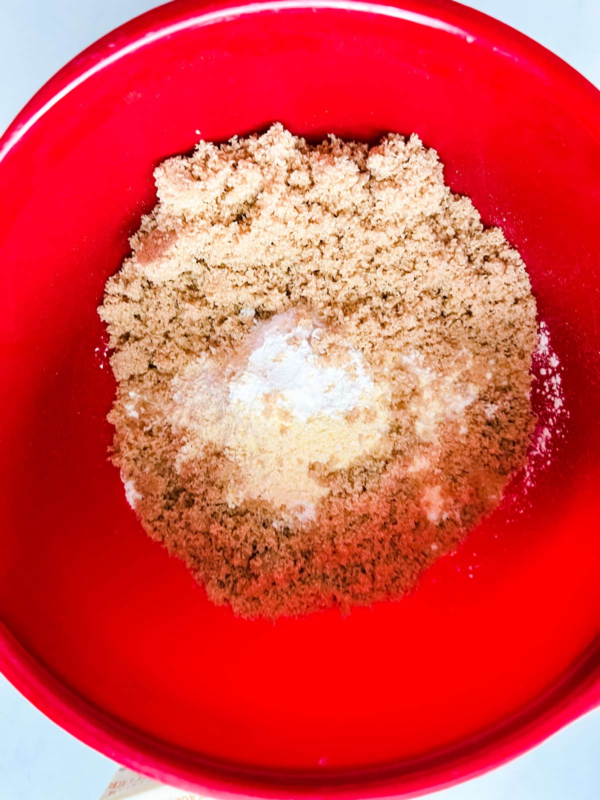 Flour, cornmeal, brown sugar, baking powder, and salt in a bowl.