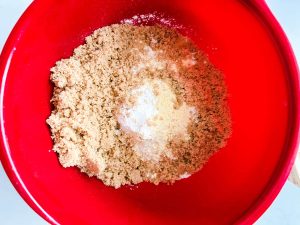 Flour, cornmeal, brown sugar, baking powder, and salt in a bowl.