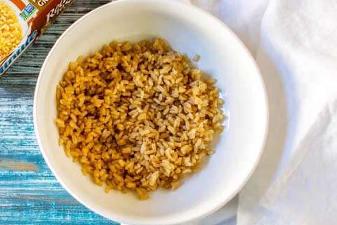 Brown rice in a white bowl.