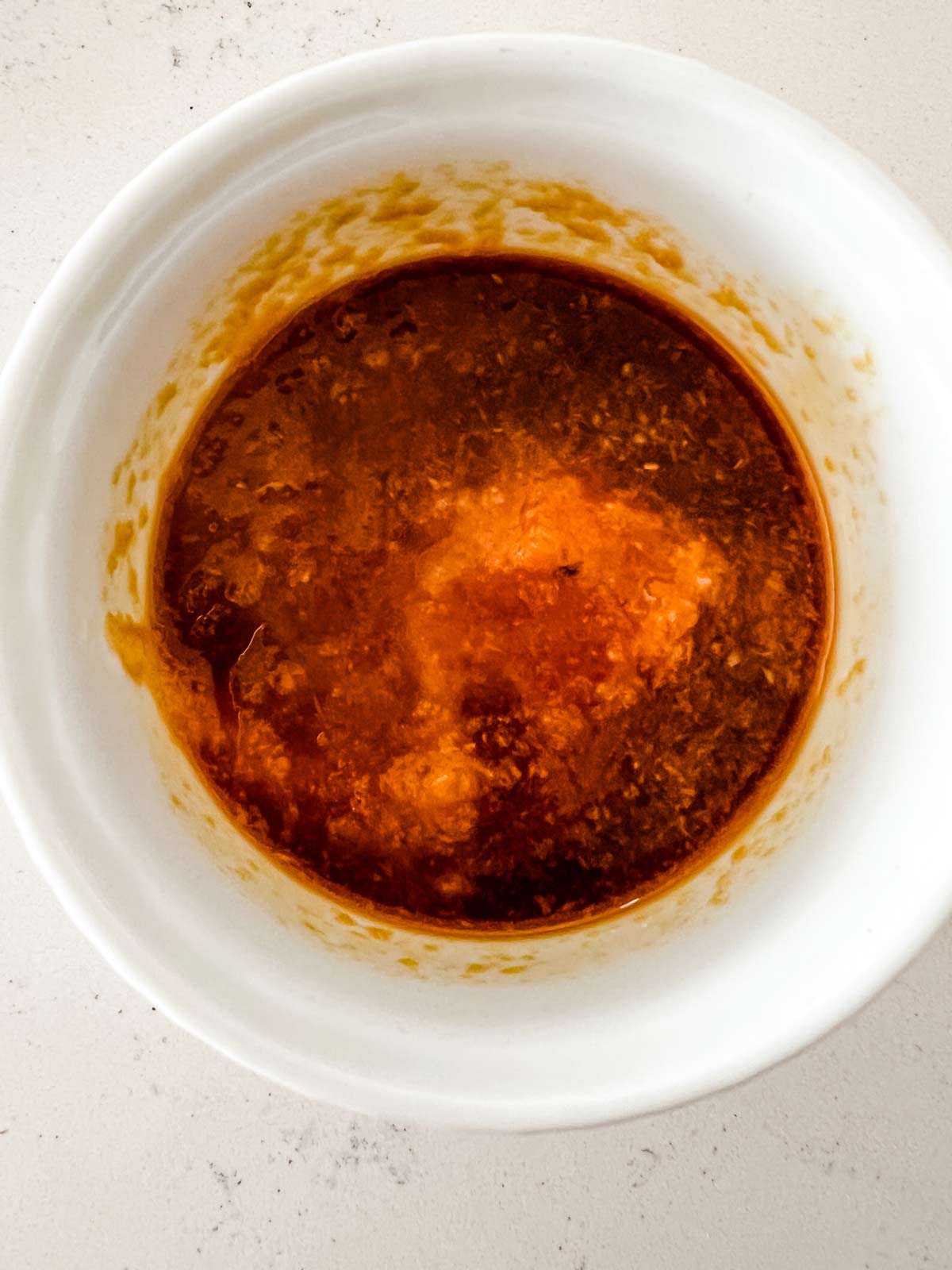 Soy sauce mixture in a white bowl.