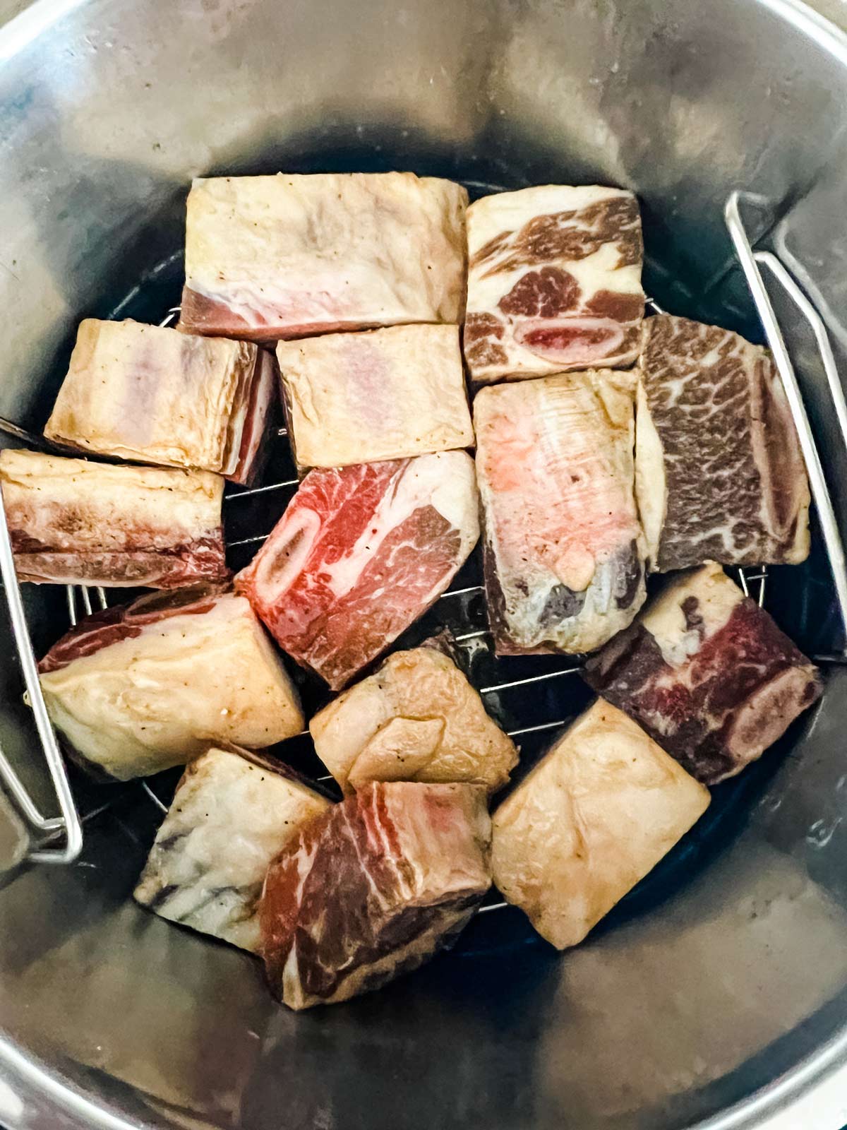 Beef ribs in an Instant Pot ready to cook.