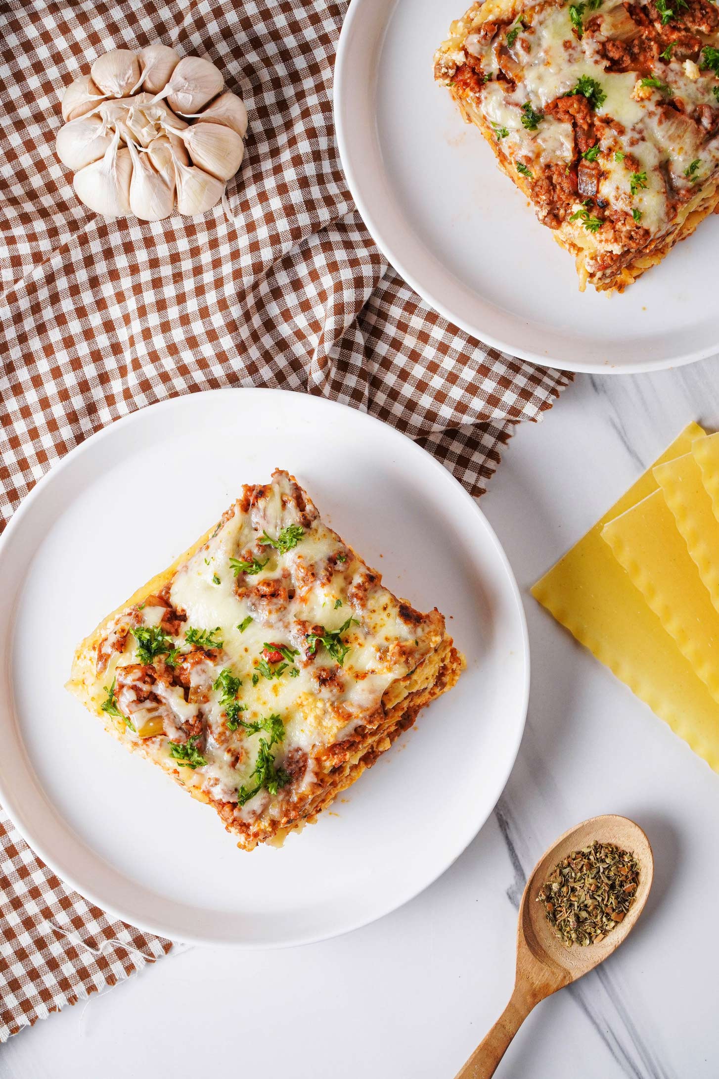 Overhead photo of crockpot lasagna on a white plate.