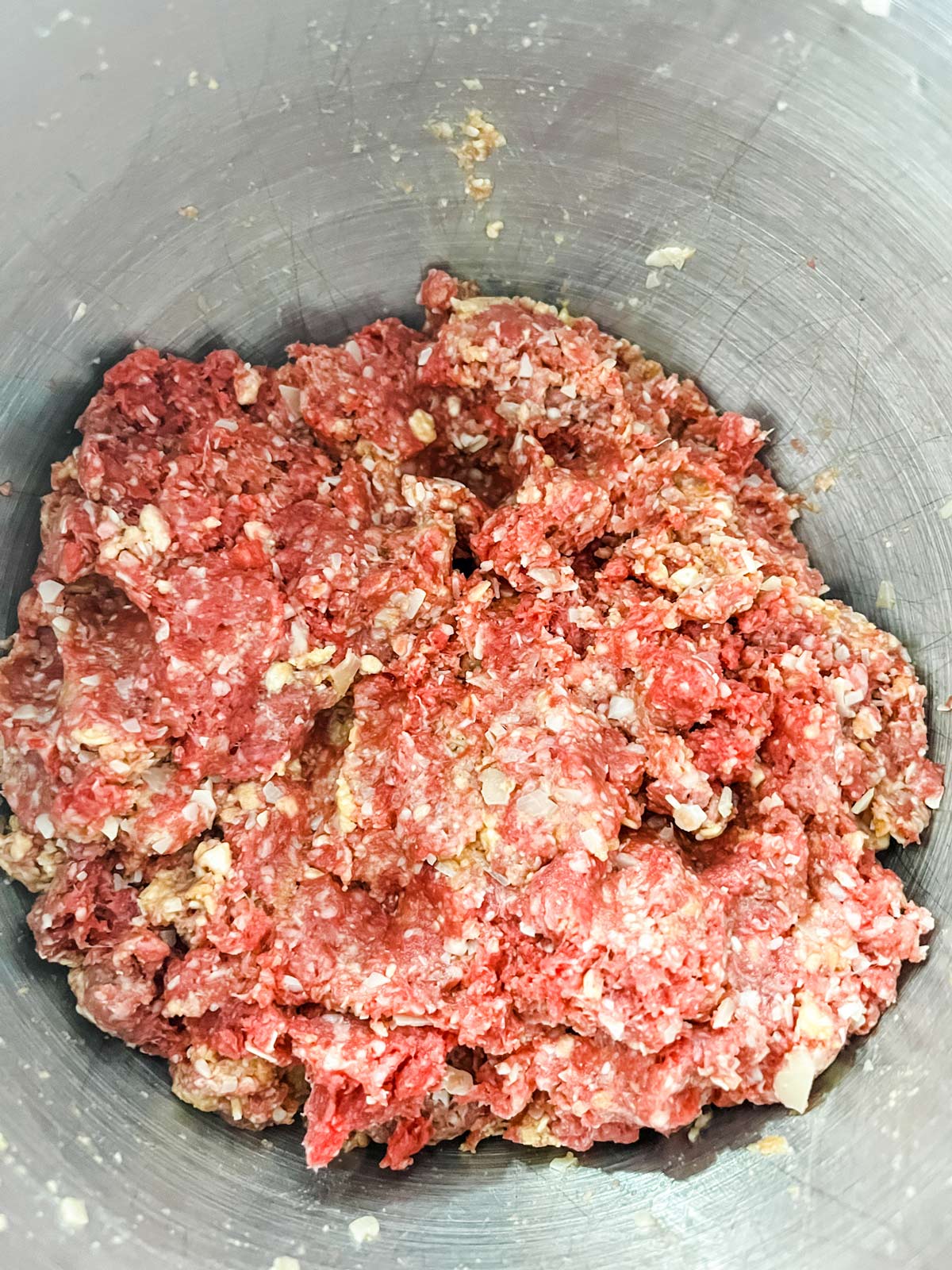 A meatloaf mixture in a bowl.
