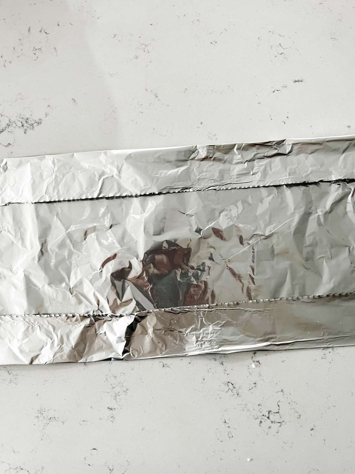 A piece of heavy duty foil with the sides folded in.