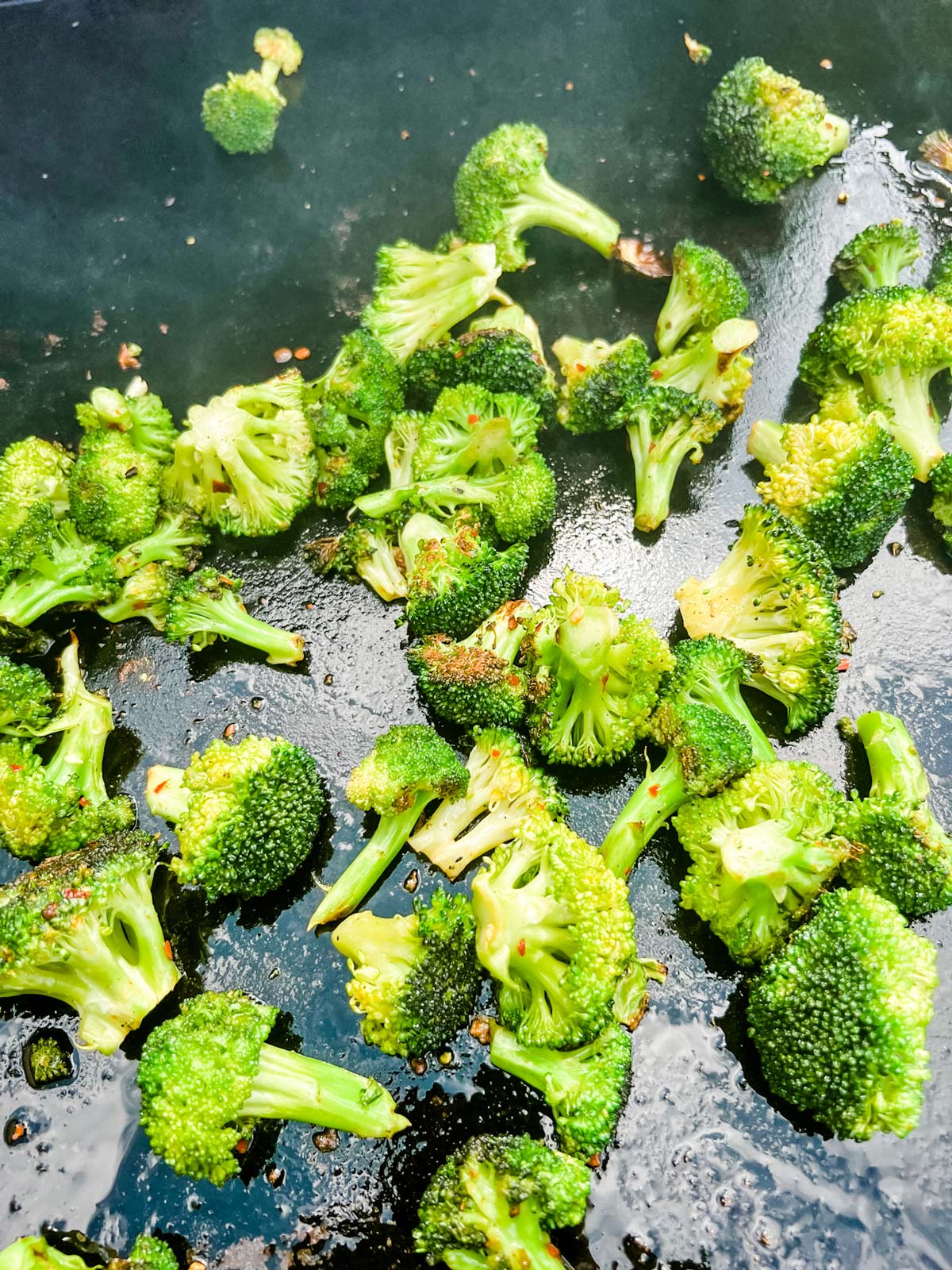 Lightly charred broccoli on a Blackstone griddle.