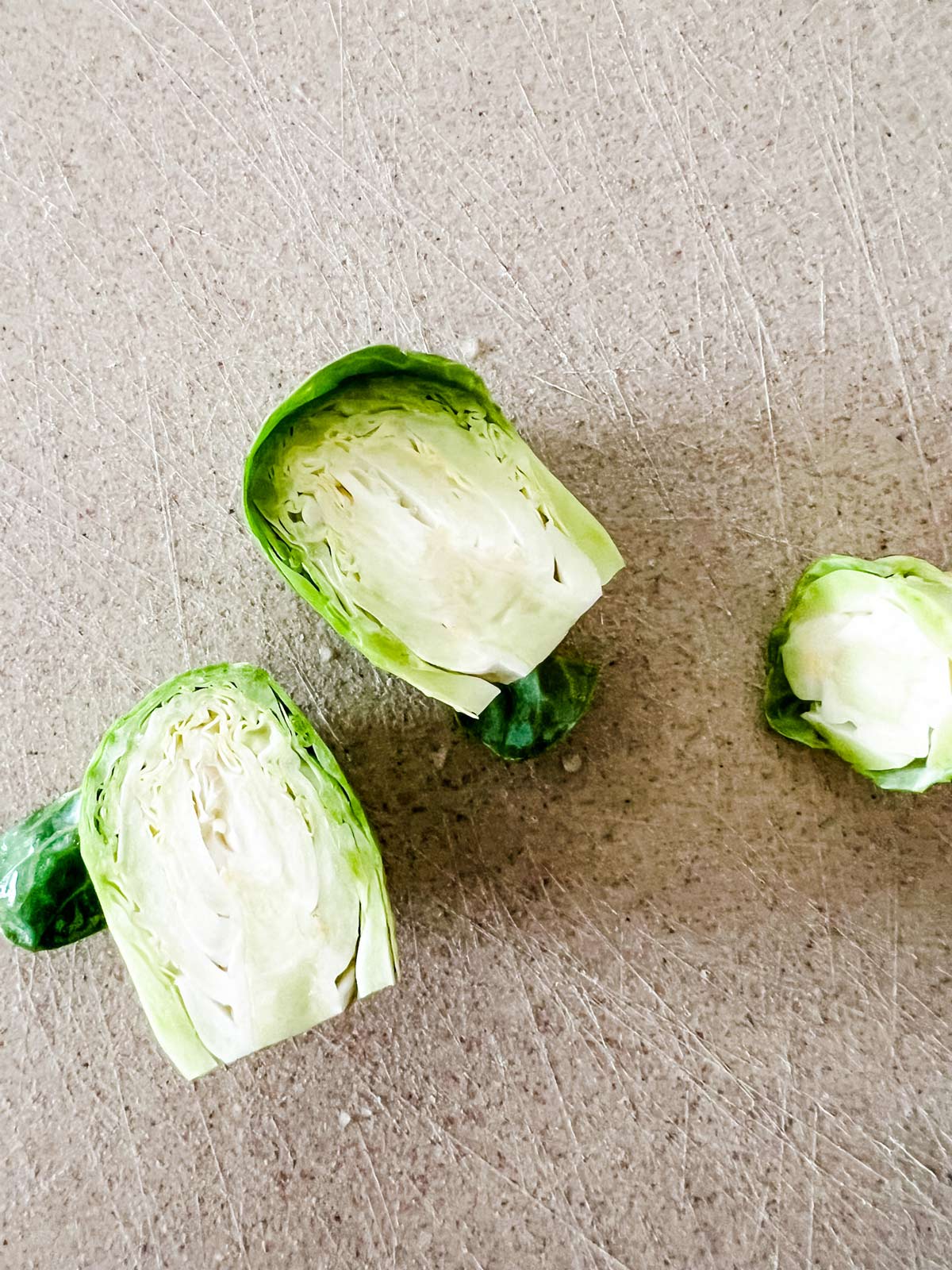 A Brussels sprout being trimmed.