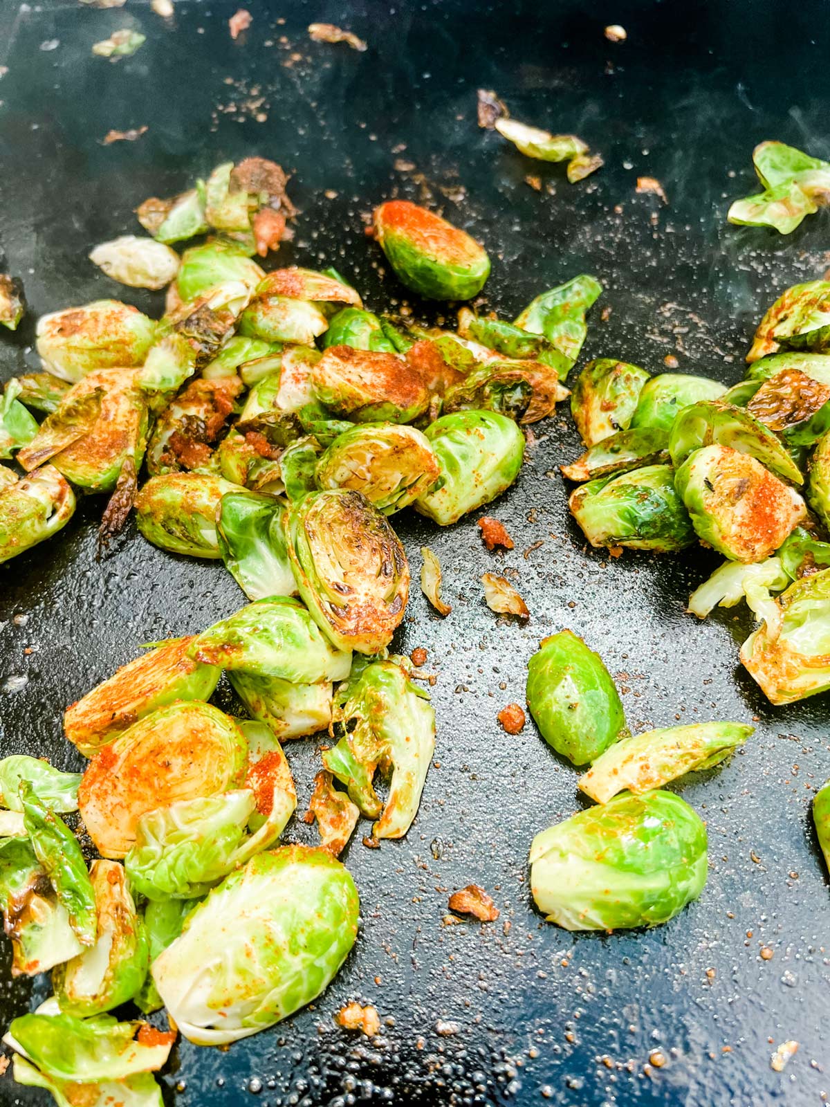 Seasoned Brussels sprouts on a Blackstone griddle.