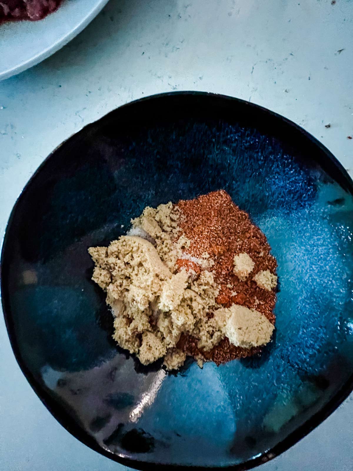 BBQ seasoning and brown sugar in a small bowl.