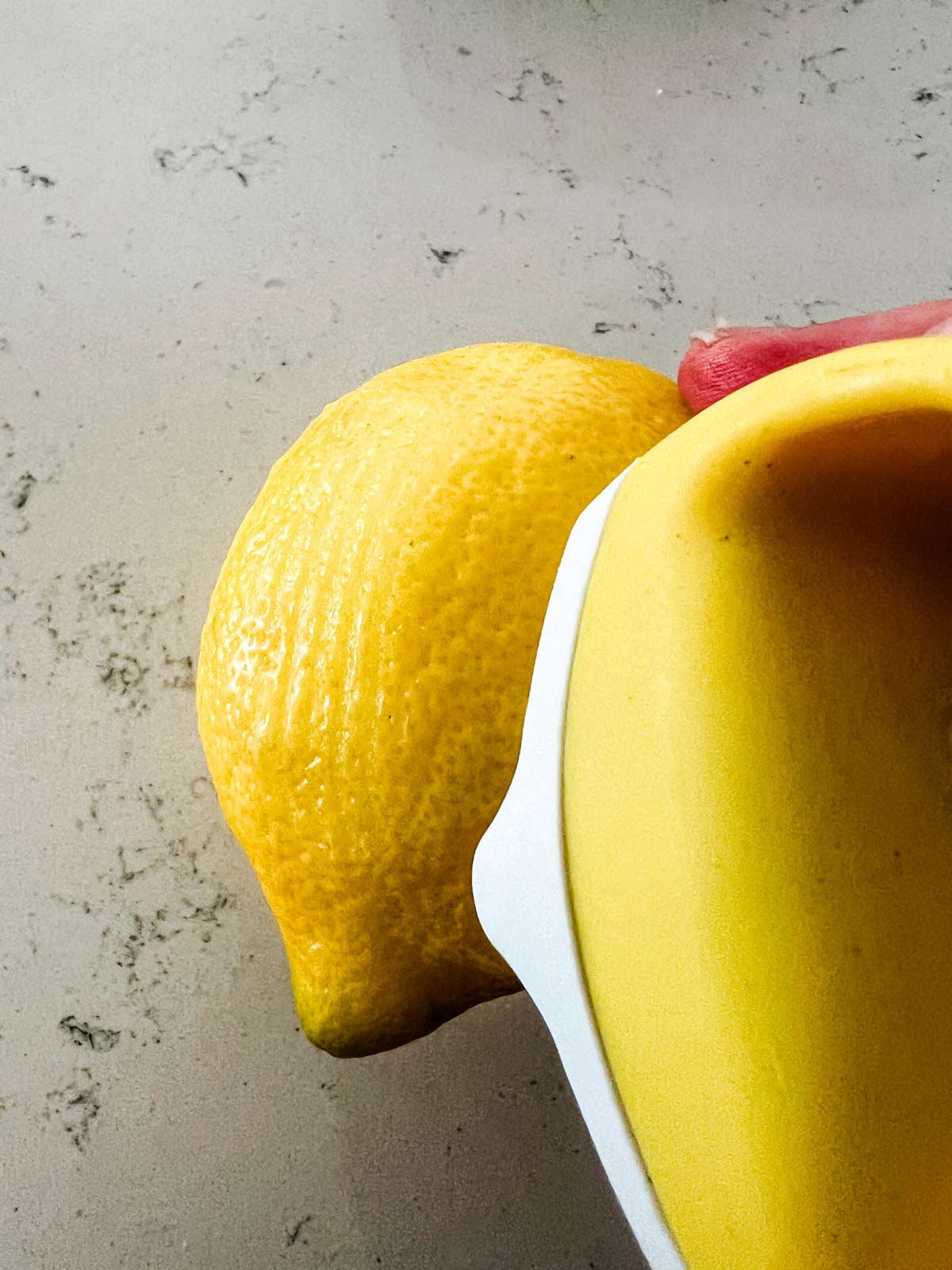 Photo of a lemon being zested.