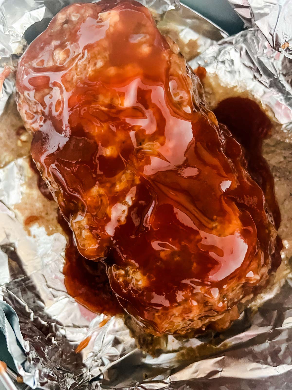 Glazed meatloaf ready to broil in a Ninja Foodi.