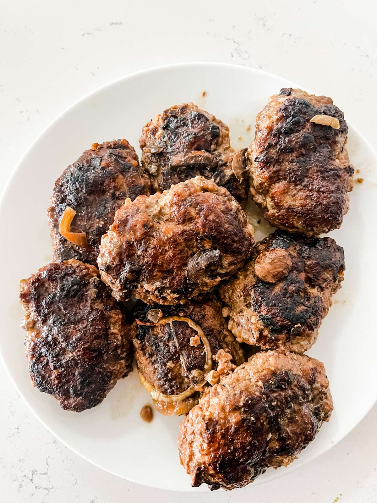 Seared and then slow cooked salisbury steak patties.