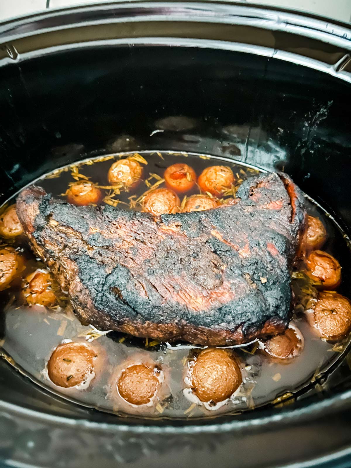 A slow cooker tri tip ready to cook.