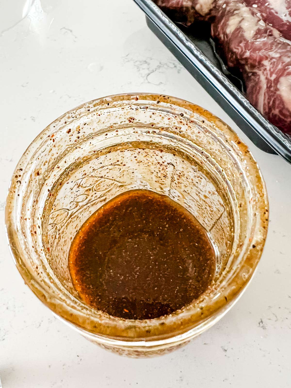 Steak taco marinade in a glass jar.