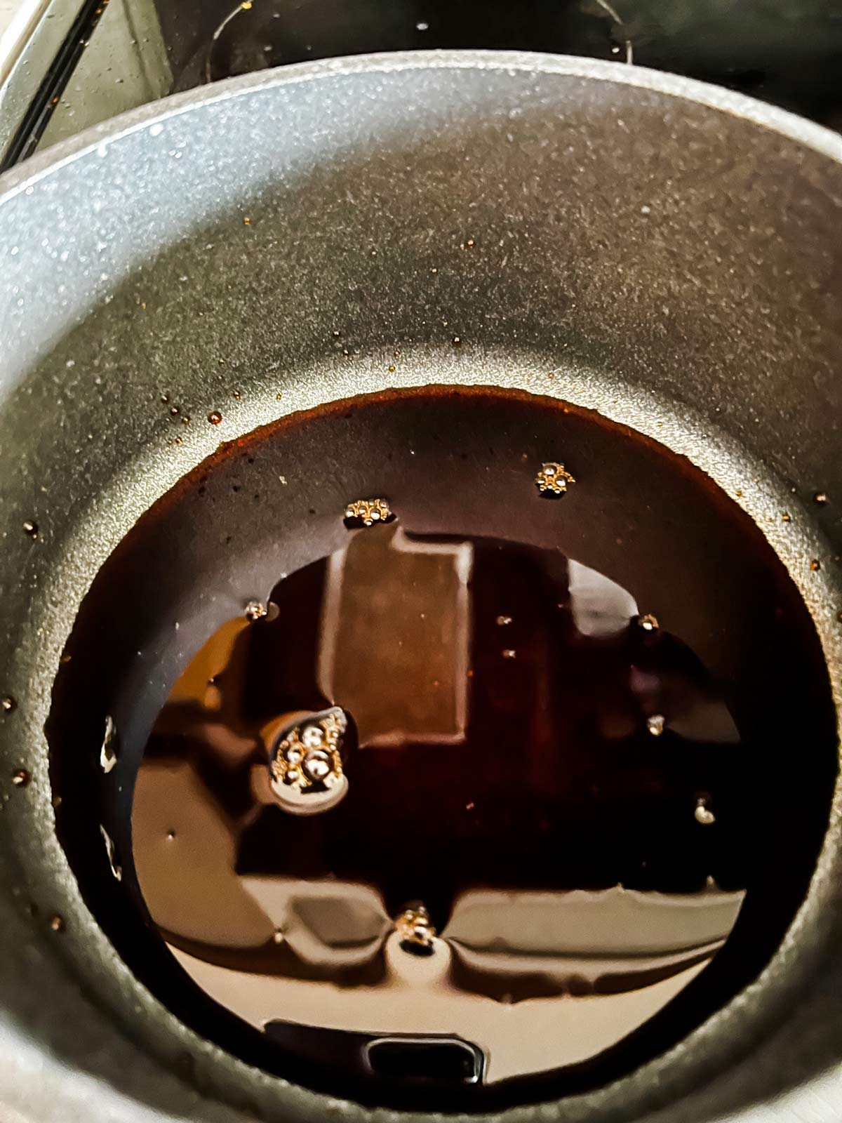 Photo of balsamic vinegar reducing in a saucepan.