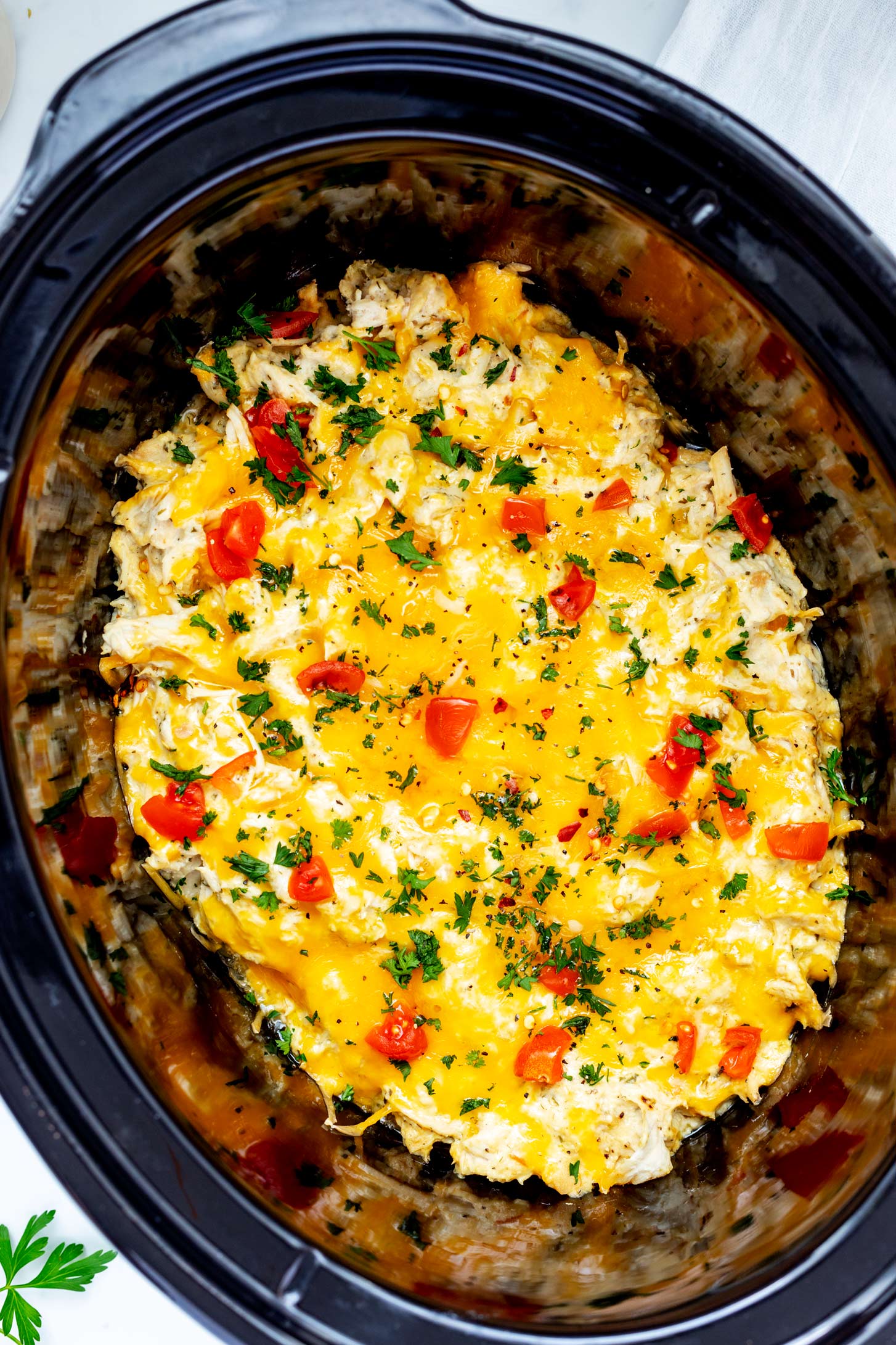 Overhead close up photo of slow cooker ranch chicken in a crockpot.