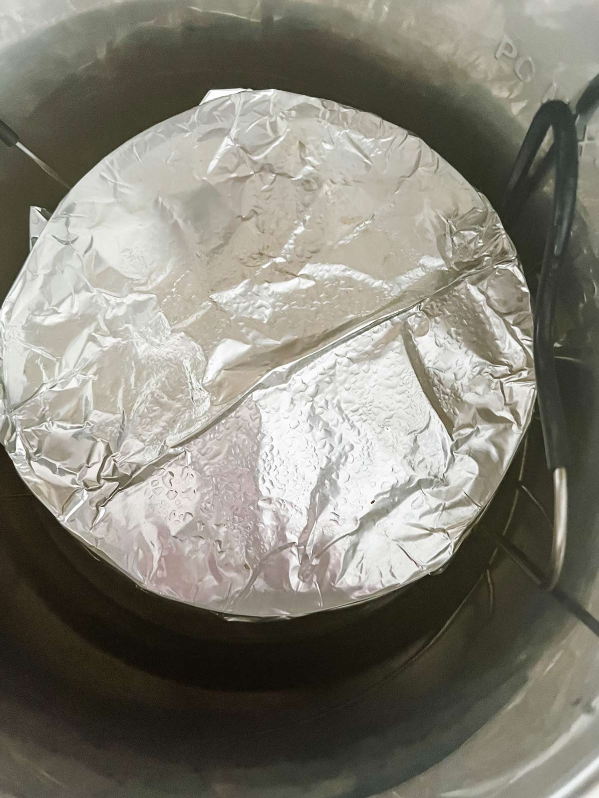 Foil covered egg bites that have just been cooked in an Instant Pot.