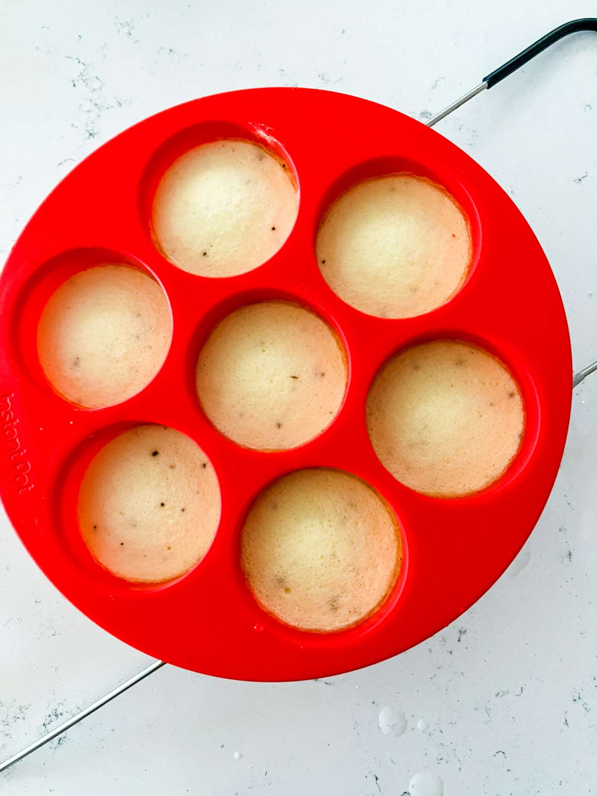 Cooked instant pot egg bites in a silicone mold.