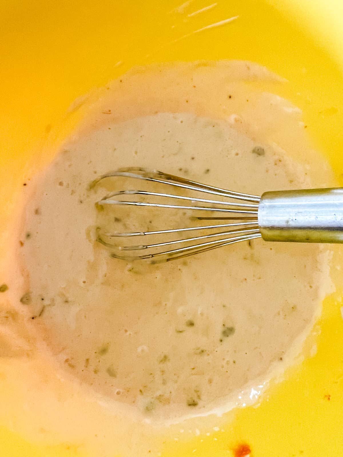 Mayonnaise , apple cider vinegar, pickle relish, yellow mustard, sugar, hot sauce, salt and pepper in a bowl whisked together.