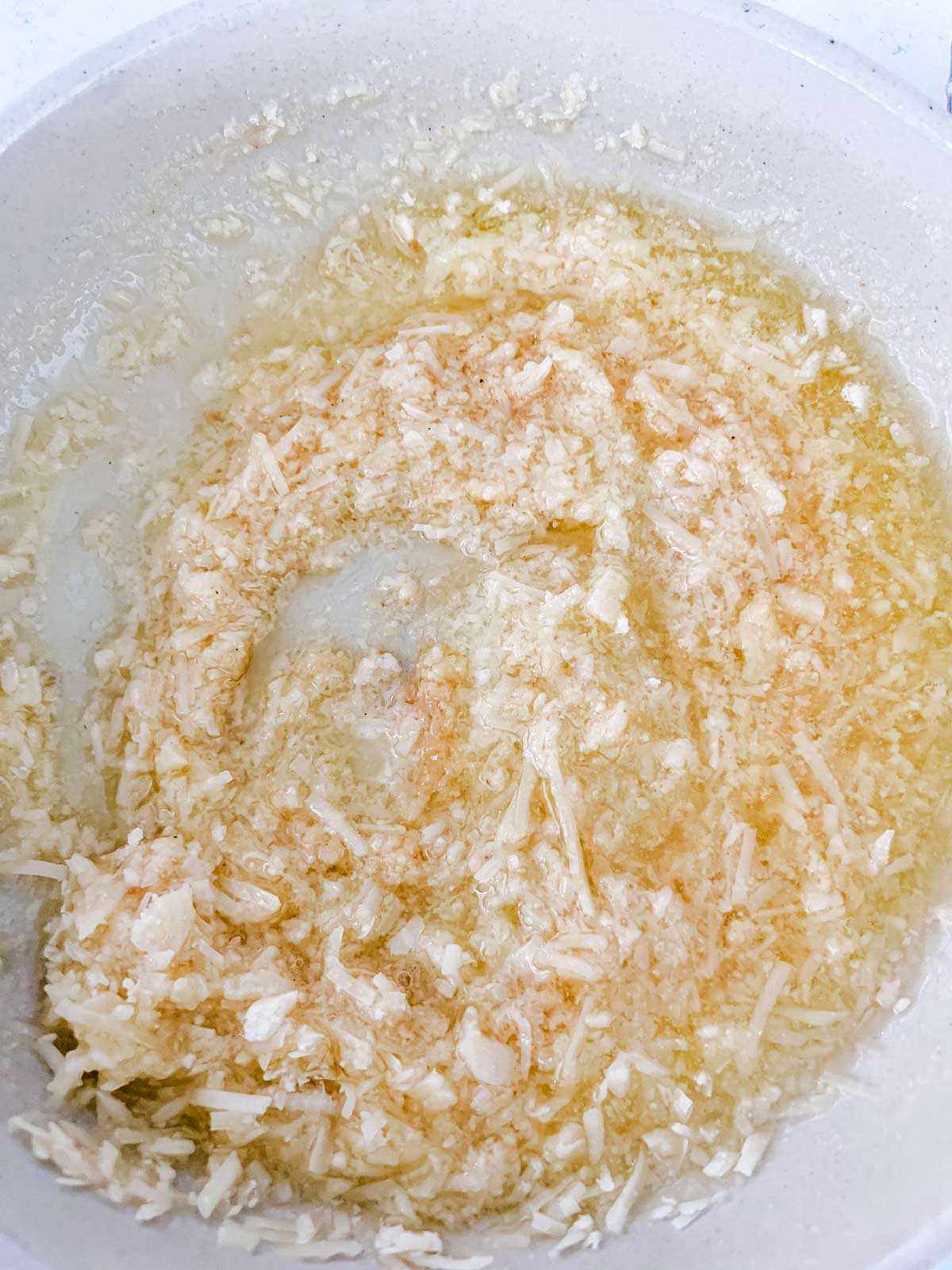 A cheesy oil and seasoning mixture for garlic bread.