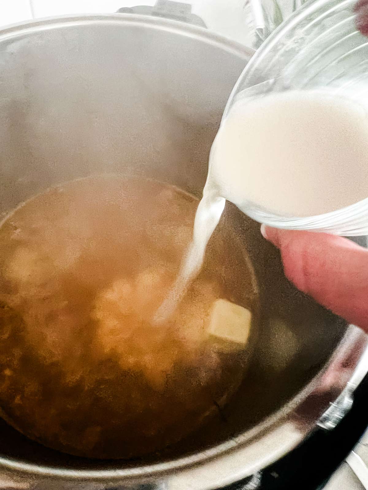 Corn starch slurry poured into the broth from Instant Pot turkey to make gravy.