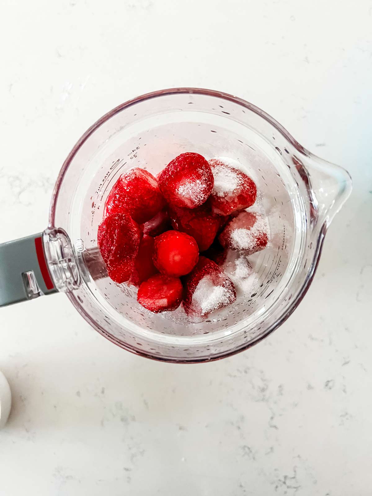 Strawberries, lemon juice and sugar in a blender.