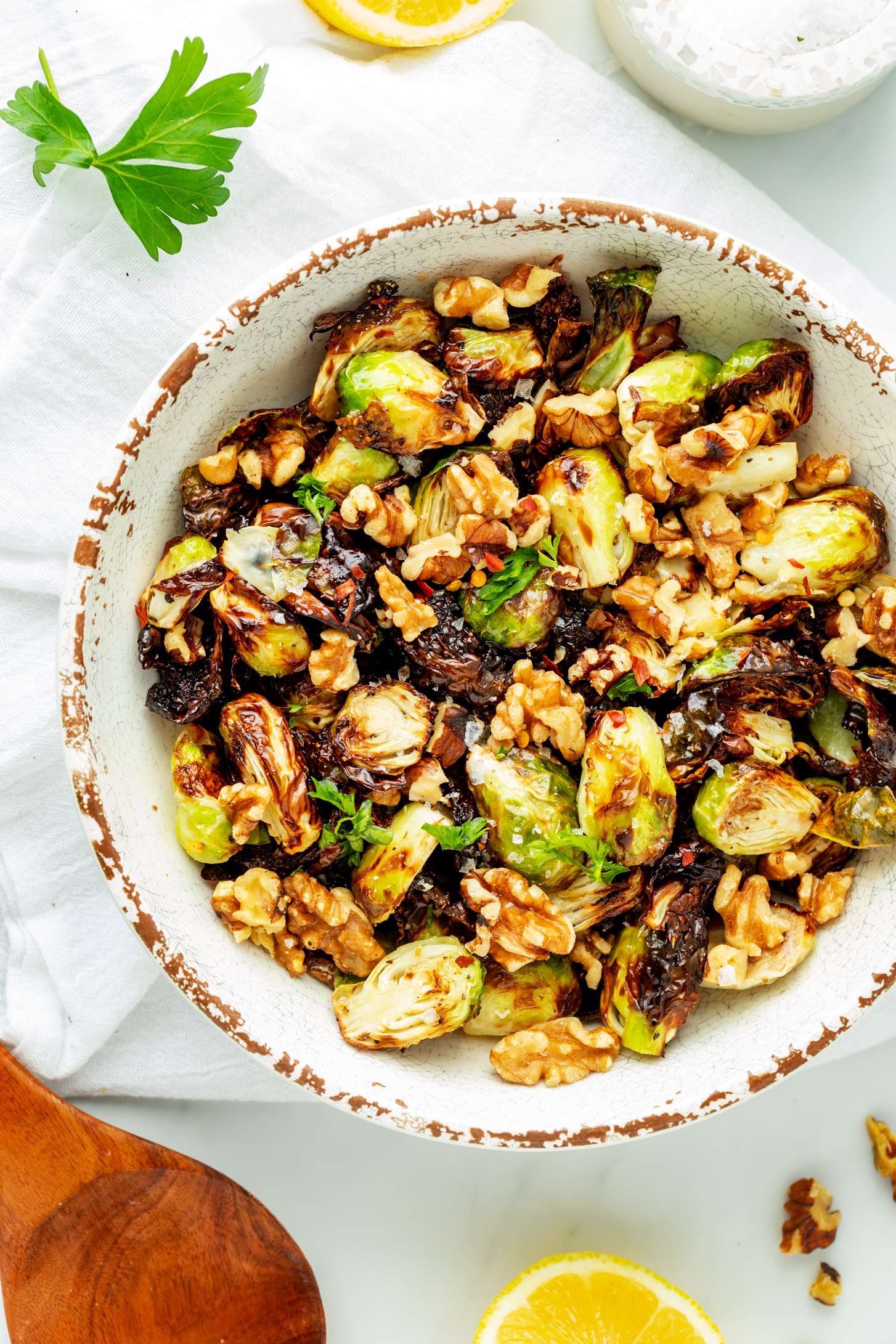 Overhead photo of a rustic bowl with Ninja Foodi Brussels sprouts.