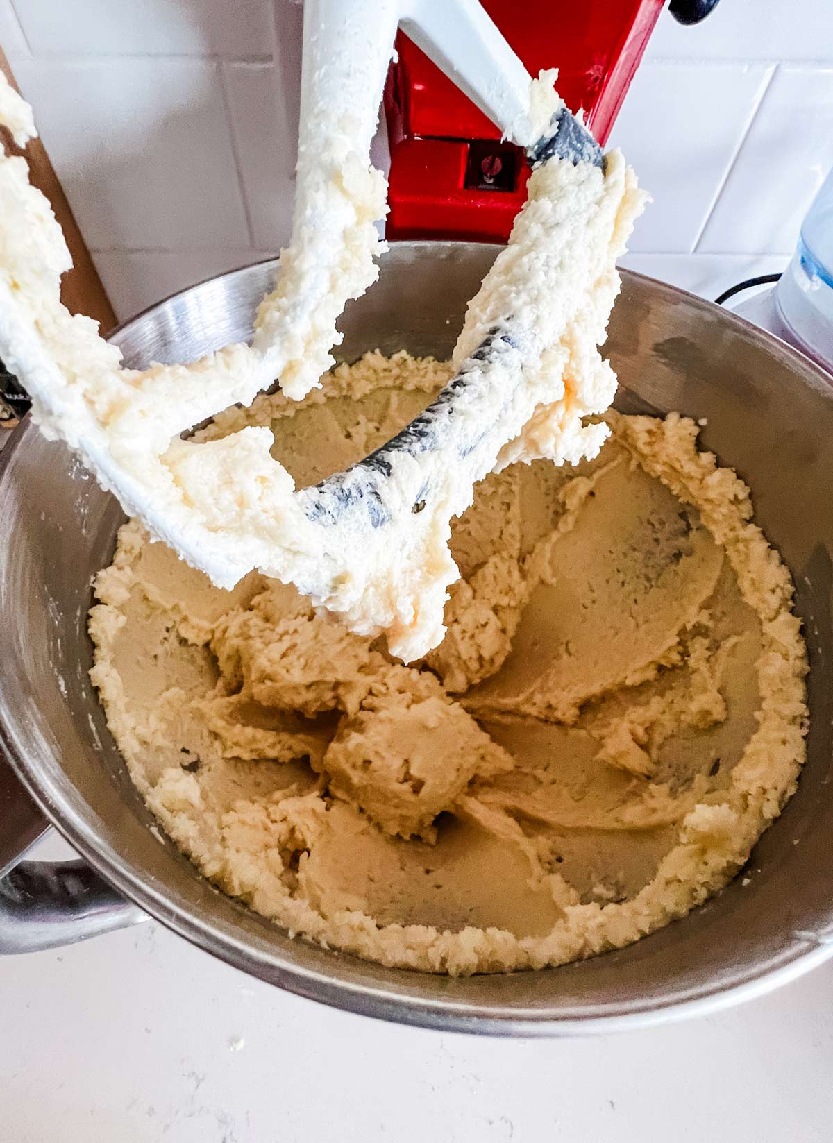 Creamed butter and sugar in the bowl of a stand mixer.