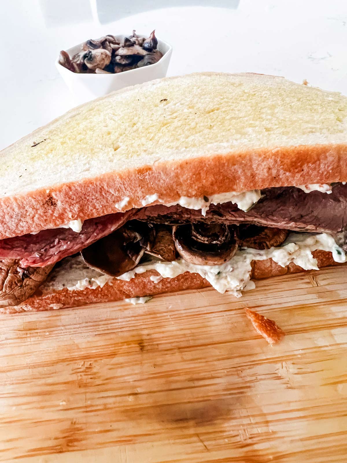 Side photo of a prepped roast beef panini ready for the panini press.