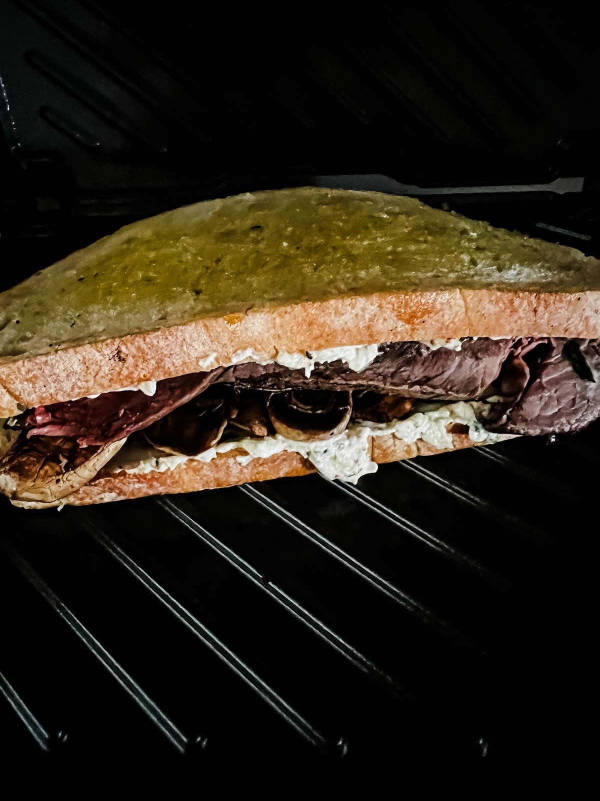 Roast beef panini in a panini press.