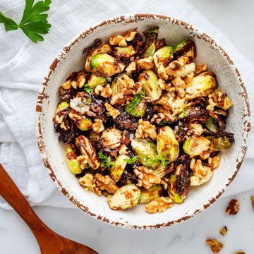Overhead photo of Ninja Foodi Brussels Sprouts in a rustic bowl.