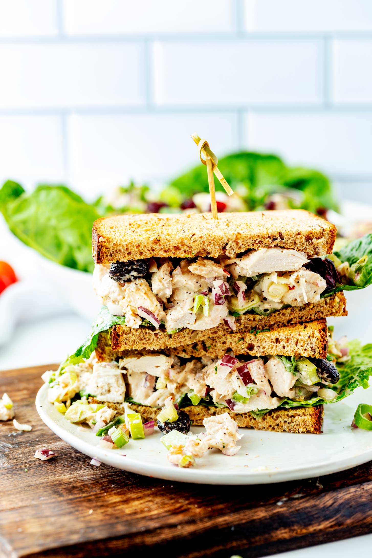 A turkey salad sandwich cut in half and stacked.