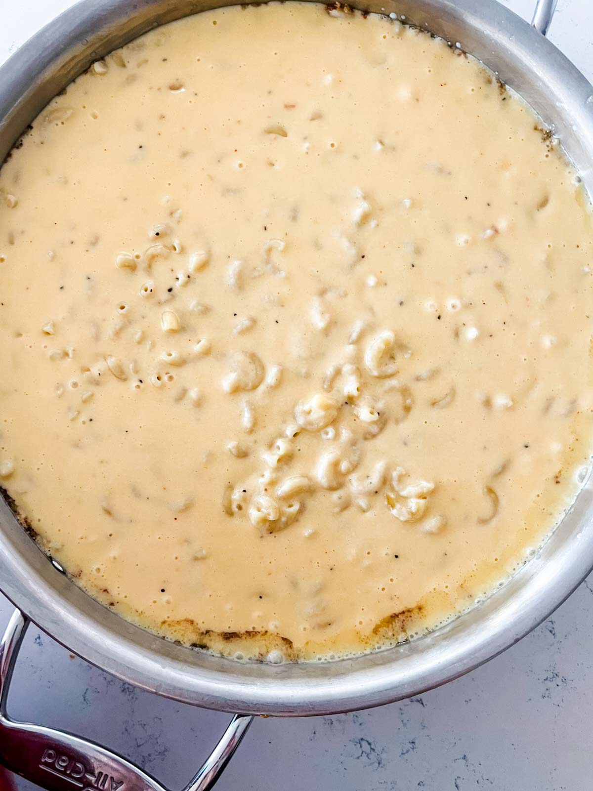 Overhead photo of gouda mac and cheese in a large skillet.